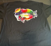 a black t - shirt with a colorful lip on it