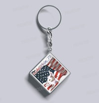 a square keychain with an american flag on it