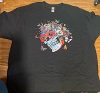 a black t - shirt with a cartoon character on it