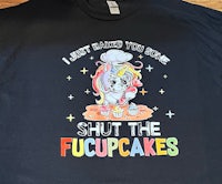 a black t - shirt that says shut the fuckcakes